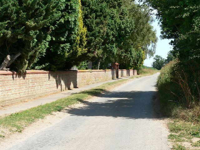 The Balk, Slingsby. Slingsby cemetery is behind the wall in the photograph. The Balk is the name of the lane to it