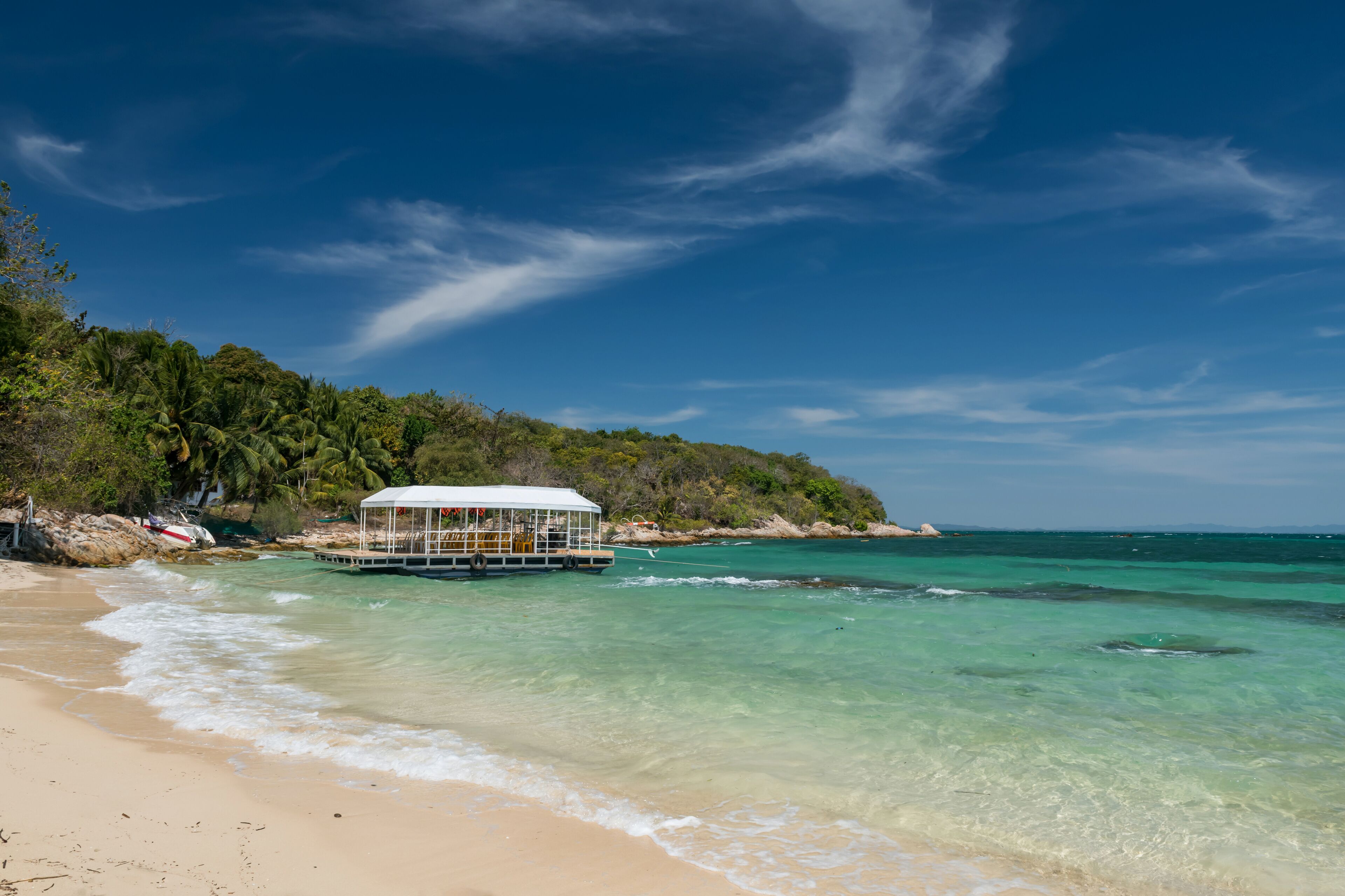 Ferry boat on turquoise sea at Ko Man Klang, Rayong, Thailand