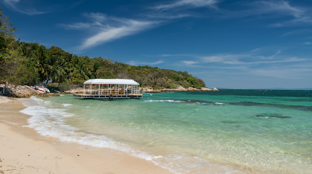 Ferry boat on turquoise sea at Ko Man Klang, Rayong, Thailand