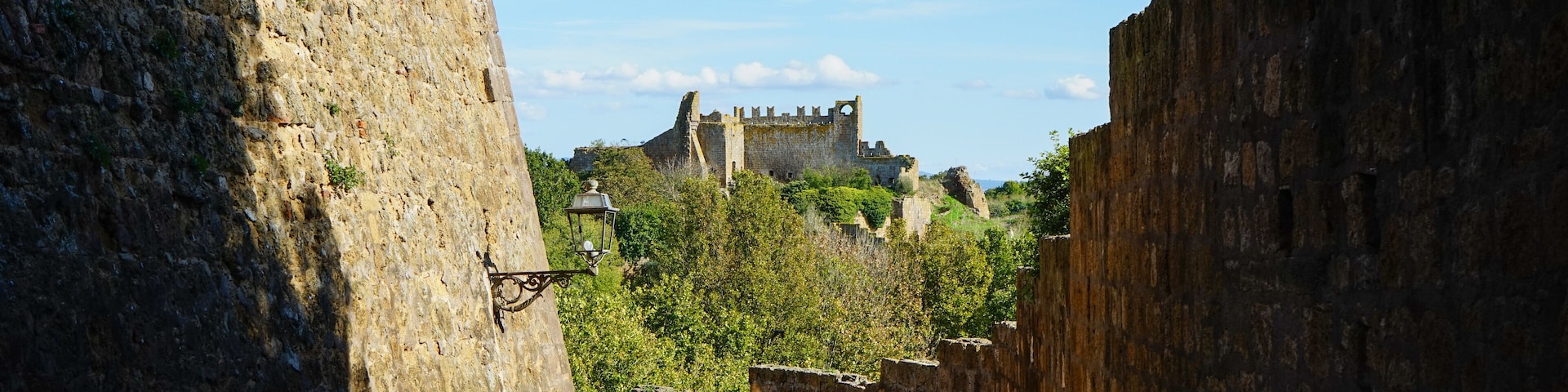 San Pietro church view over the hill between Tuscania village's walls, Viterbo, Lazio, Italy