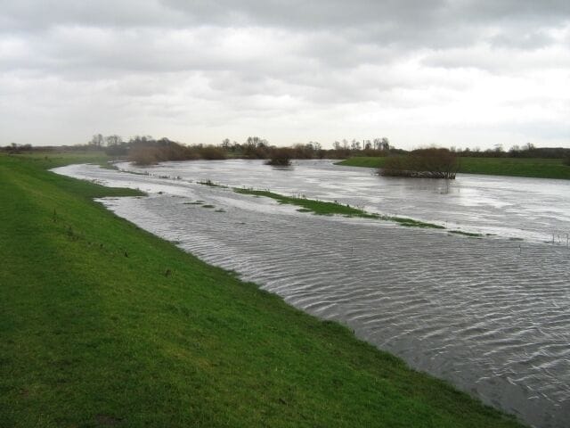 Bend around Gardener's Grounds, Rawcliffe, East Riding of Yorkshire, England. River Aire in full flood meandering it's way towards the Ouse takes a 90 degree turn towards Rawcliffe and around Gardener's Grounds on the left.