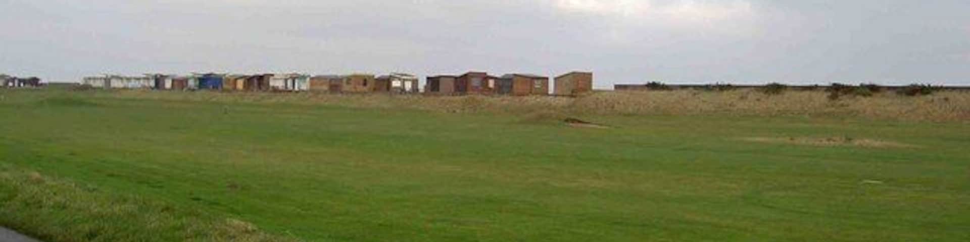 Sandilands golf course From Roman Bank, note the beach huts on the horizon.