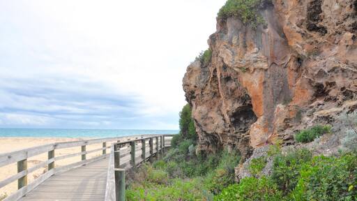GAWFGE Boardwalk with rugged limestone formations at the Moore river mouth to the Indian Ocean in Guilderton, Western Australia.