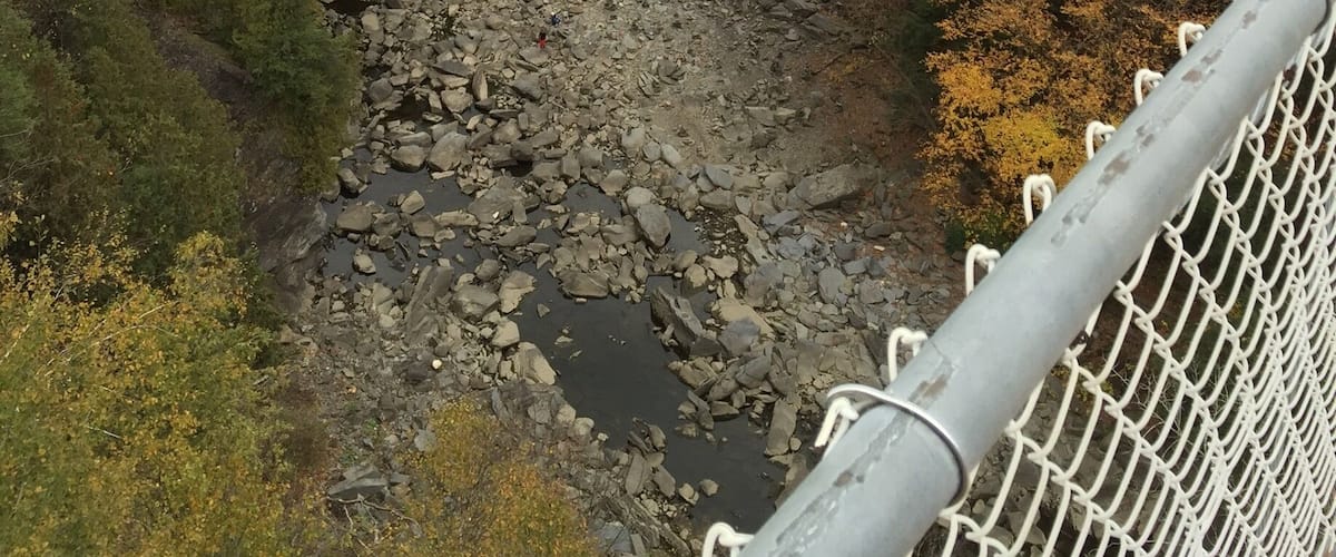 The suspension bridge over the Coaticook Gorge is the longest pedestrian suspension bridge in the world. Visiting in Early October will afford you views of the autumn colours.