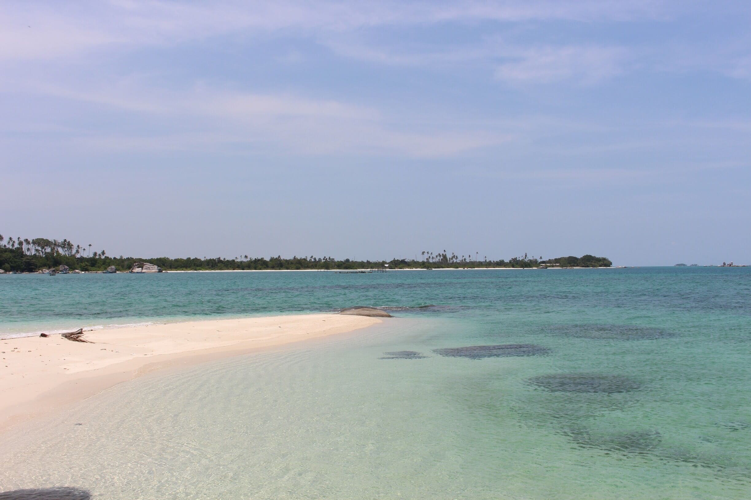 Another breathtaking view at another island off of Belitung. There are a plethora of stunning islands off of Belitung island. Each one is surrounded with captivating and dramatic rocks, clear water that makes you want to jump in and swim all day long, and white sands. Belitung is more than twice of the size of Singapore. Despite of its almost unknown name compared to Bali, the roads around the whole island are smooth and very well taken care of. Which makes going around the island to be very easy. These fascinating smaller islands are found on the west side of Belitung. The closest ones are about ten minutes away from the dockage area. To get to Belitung you must fly from Jakarta, the capital city of Indonesia. It is a 50-minute flight. Absolutely recommend to do island hopping once you visit Belitung. It's as beautiful as island-hopping in Greece or the Mediterranean, and with warm water. It's like swimming in the bath tub of Mother Nature. 

#WeekendGetaway