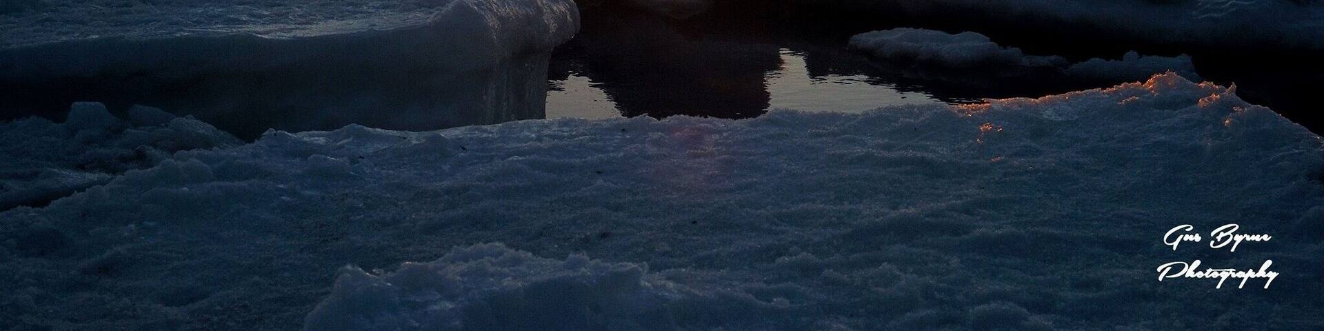 An amazing picture taken by my husband Gus Byrne. Sunset on ice filled beach