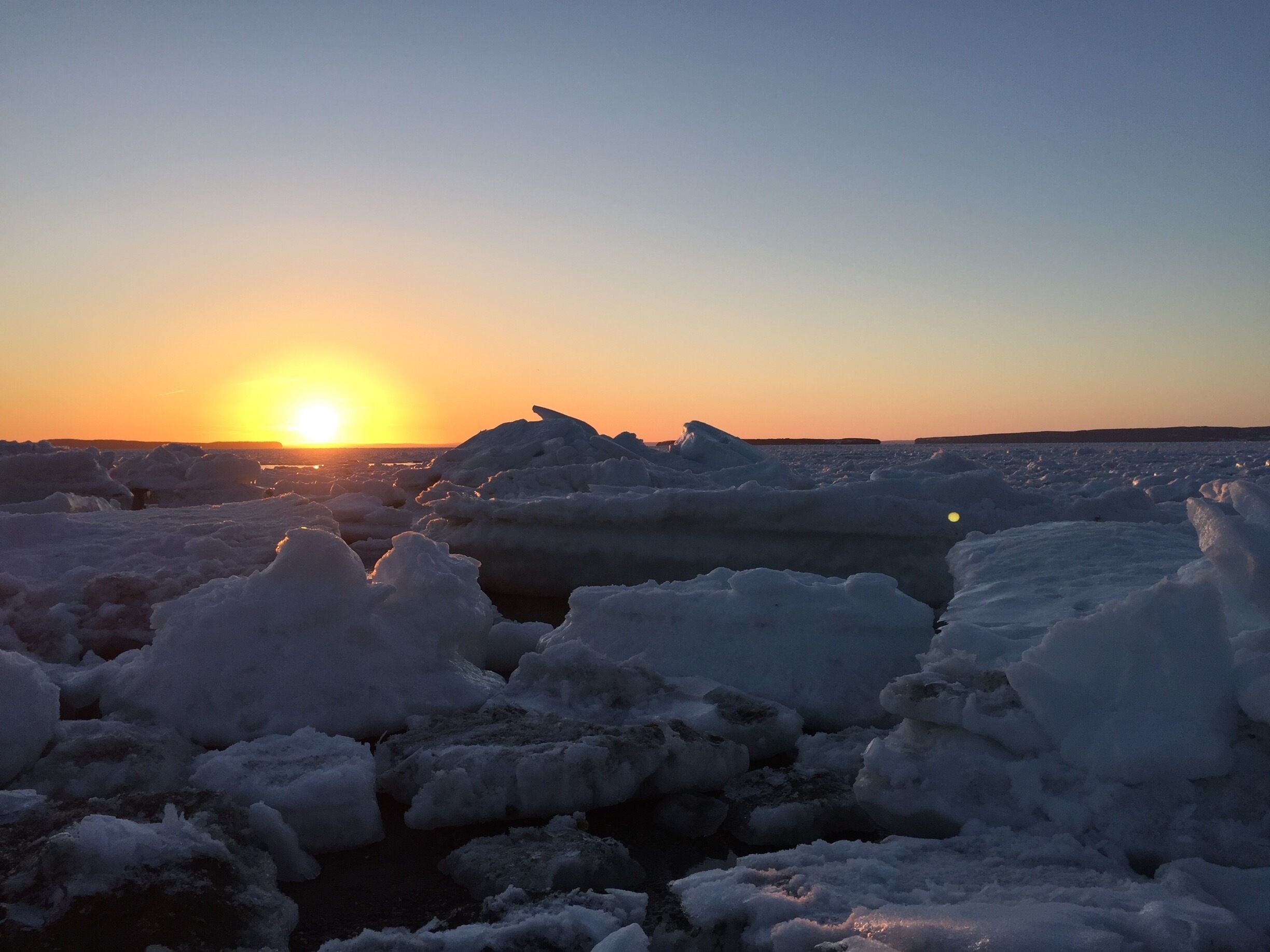 Beautiful sunset on ice filled beach