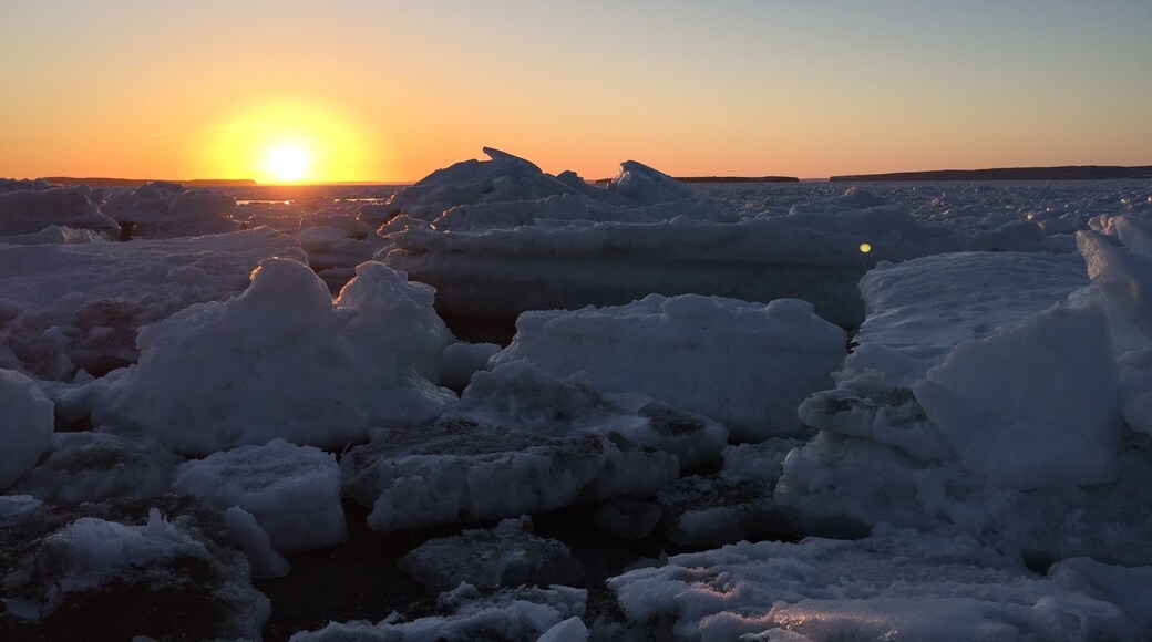 Beautiful sunset on ice filled beach