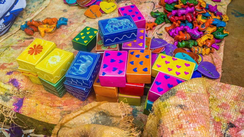 Colorful, almost finished, African soapstone souvenirs and gifts hand carved, painted and polished in Tabaka, Kisii County, Kenya. Primary occupation & source of income for local people.