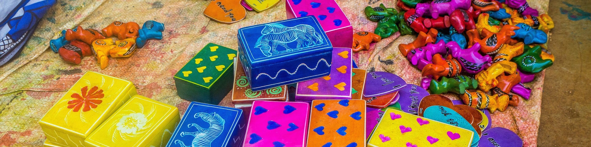 Colorful, almost finished, African soapstone souvenirs and gifts hand carved, painted and polished in Tabaka, Kisii County, Kenya. Primary occupation & source of income for local people.