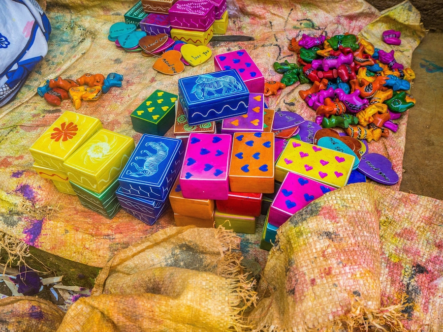 Colorful, almost finished, African soapstone souvenirs and gifts hand carved, painted and polished in  Tabaka, Kisii County, Kenya. Primary occupation & source of income for local people.