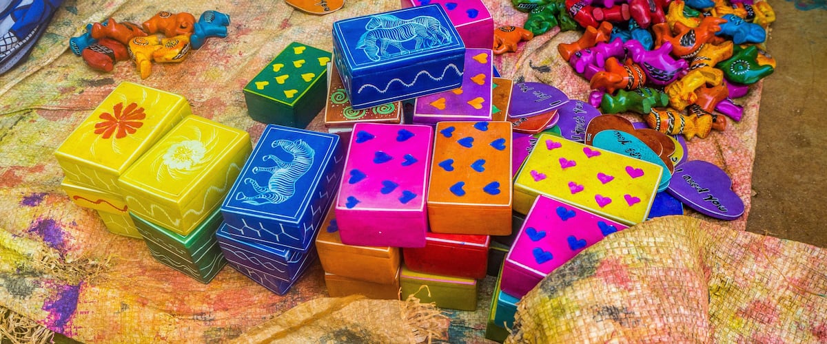 Colorful blocks and heart-shaped toys on a fabric surface.
