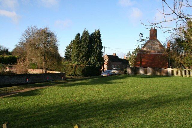 Across the green Looking across the green near the school toward the road through the village