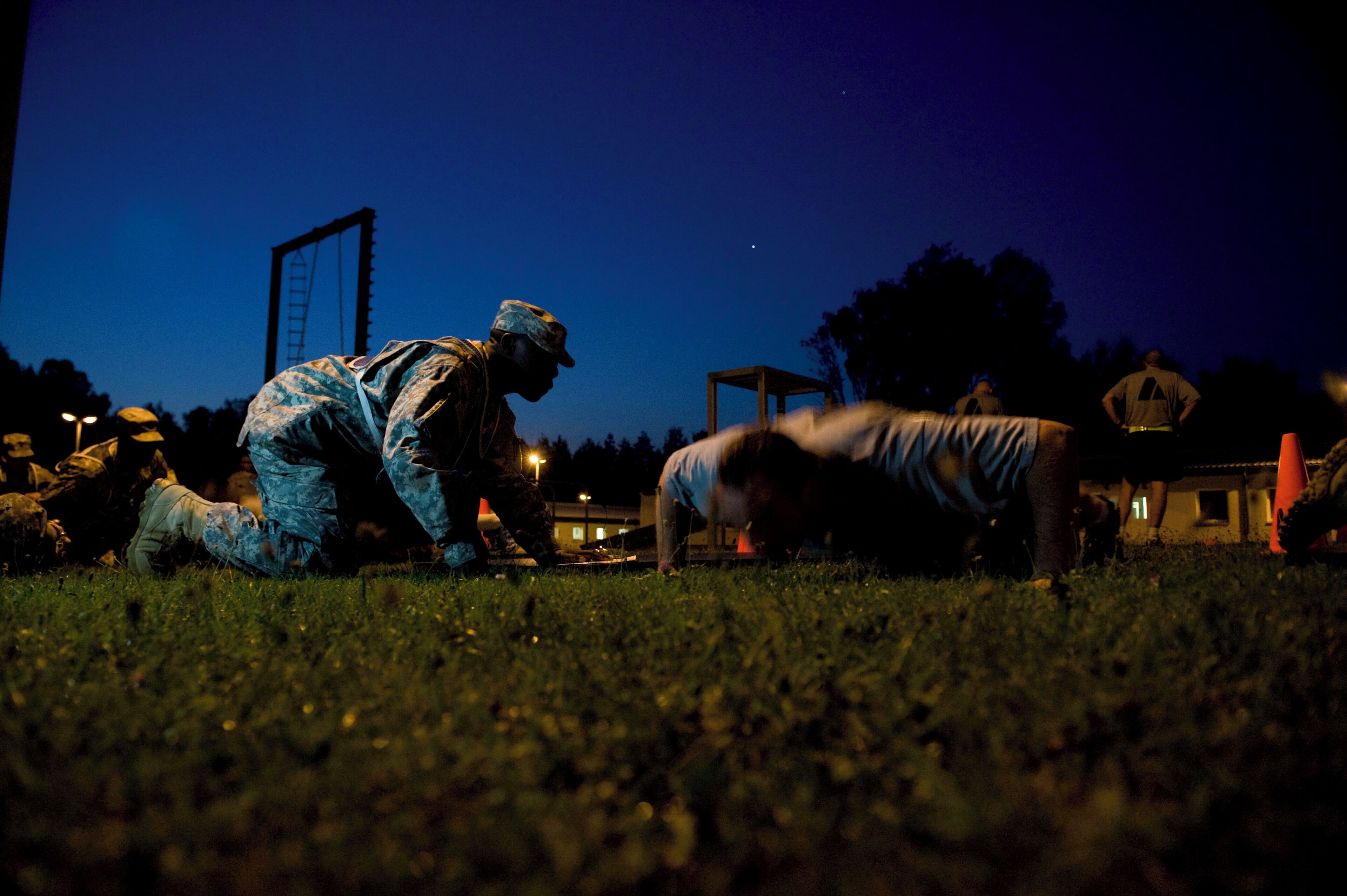 GRAFENWOEHR, Germany --- A competitor takes part in the Army Physical Fitness Test at the 7th Army Noncommissioned Officer Academy on Grafenwoehr Training Area during the first day of the U.S. Army Europe Best Junior Officer Competition. The Best Junior Officer Competition, unique to the U.S. Army in Europe, is a training event meant to challenge and refine competitors' leadership and cognitive decision-making skills in a high-intensity environment. The competition runs from July 23-27, 2012. The competitors, company-grade officers ranking from 2nd Lt. to Capt., represent Army units throughout Europe and have already distinguished themselves amongst their peers and exemplify the profession of arms. The competition brings these up-and-coming young leaders together for five days of physically and mentally challenging training, all for the chance to be named U.S. Army Europe's "Best Junior Officer" for 2012. Challenges include pistol and rifle qualifications, multiple foot marches, and various situational training exercises to test their intellect and instincts as leaders. The knowledge, skill-sets and leadership traits honed at this competition will help prepare the young leaders involved to excel when the time comes to lead Soldiers in a deployed environment. For more information or to see photos and video from the competition go to the U.S. Army Europe Web site www.eur.army.mil/BestOfficer. (U. S. Army Europe photo by Spc. Joshua E. Leonard)