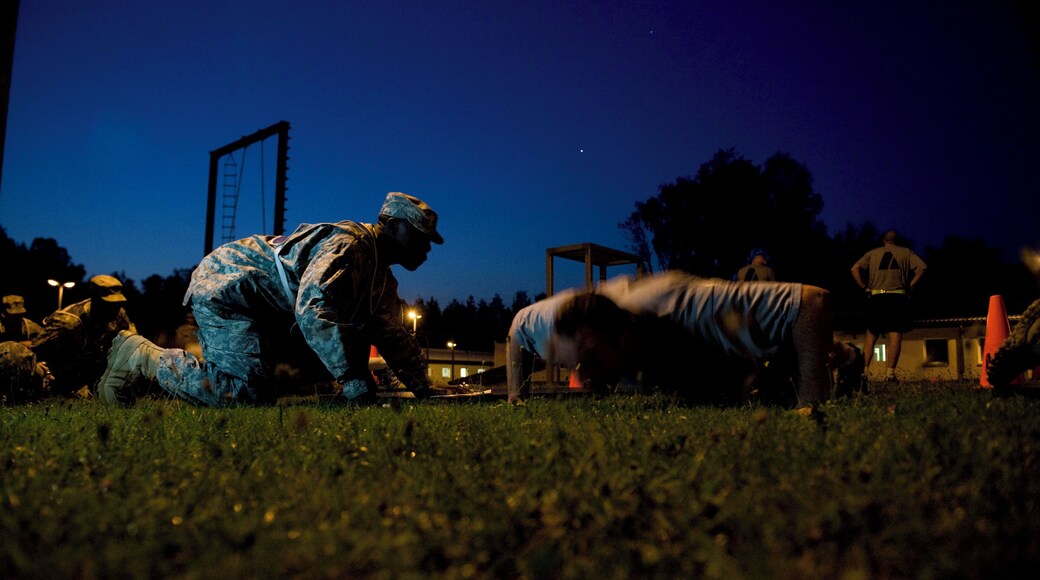 GRAFENWOEHR, Germany --- A competitor takes part in the Army Physical Fitness Test at the 7th Army Noncommissioned Officer Academy on Grafenwoehr Training Area during the first day of the U.S. Army Europe Best Junior Officer Competition. The Best Junior Officer Competition, unique to the U.S. Army in Europe, is a training event meant to challenge and refine competitors' leadership and cognitive decision-making skills in a high-intensity environment. The competition runs from July 23-27, 2012. The competitors, company-grade officers ranking from 2nd Lt. to Capt., represent Army units throughout Europe and have already distinguished themselves amongst their peers and exemplify the profession of arms. The competition brings these up-and-coming young leaders together for five days of physically and mentally challenging training, all for the chance to be named U.S. Army Europe's "Best Junior Officer" for 2012. Challenges include pistol and rifle qualifications, multiple foot marches, and various situational training exercises to test their intellect and instincts as leaders. The knowledge, skill-sets and leadership traits honed at this competition will help prepare the young leaders involved to excel when the time comes to lead Soldiers in a deployed environment. For more information or to see photos and video from the competition go to the U.S. Army Europe Web site www.eur.army.mil/BestOfficer. (U. S. Army Europe photo by Spc. Joshua E. Leonard)
