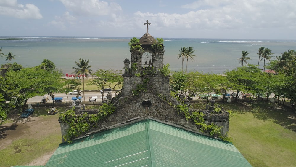 Old, ancient St Joseph church in the city of Barcelona, Sorsogon, Philippines. Church in the Spanish style on the coast near sea.
