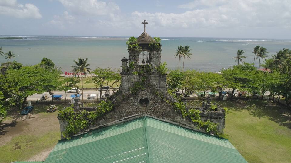 Old, ancient St Joseph church in the city of Barcelona, Sorsogon, Philippines. Church in the Spanish style on the coast near sea.