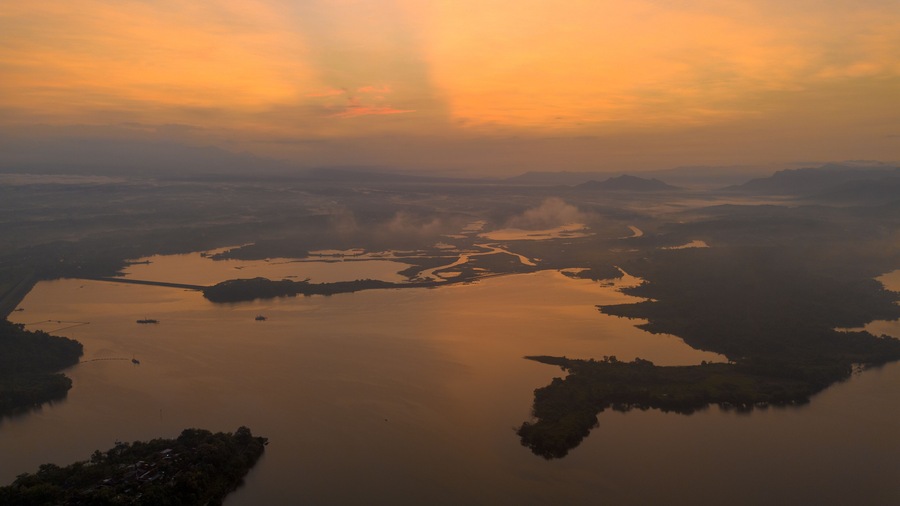 Drone aerial view of morning sunrise with lake view at Wonogiri, Central Java, Indonesia