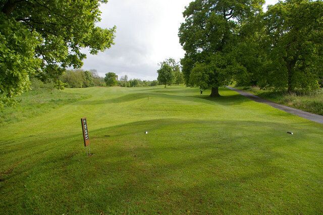13th Tee The 13th hole at Orchardleigh golf course. This is the 352yd par 4 tee. The distant chimney is at Staplemead Creamery.