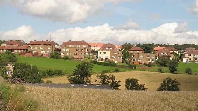 Haggs View of the village across arable land beside the Bonny Water. Taken from the Forth and Clyde canal towpath.