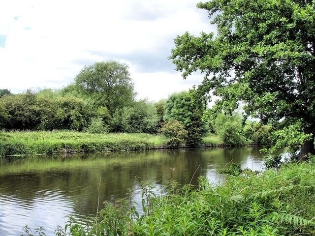 River Weaver near Kingsmead View from Davenham footpath 2 beside the River Weaver near Kingsmead across the river to Marshall's Arm Nature Reserve on the Hartford bank.