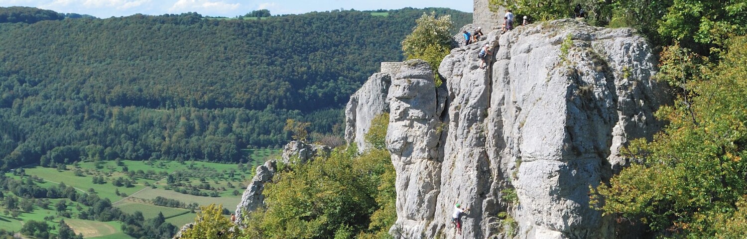 Reussenstein Castle (Baden-WĂŒrttemberg, Germany), with climbers on the rock.