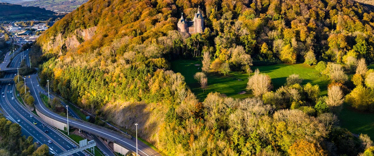 Aerial view of the fairy tale Castle Coch and A470 near Cardiff, Wales during autumn