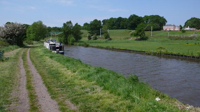 Staffordshire and Worcestershire Canal. There are many canal boats along this stretch of water.