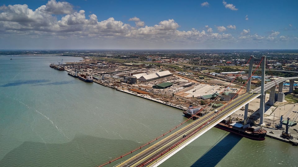 Mozambique, Katembe, Aerial view of container ship sailing under Maputo-Katembe Bridge