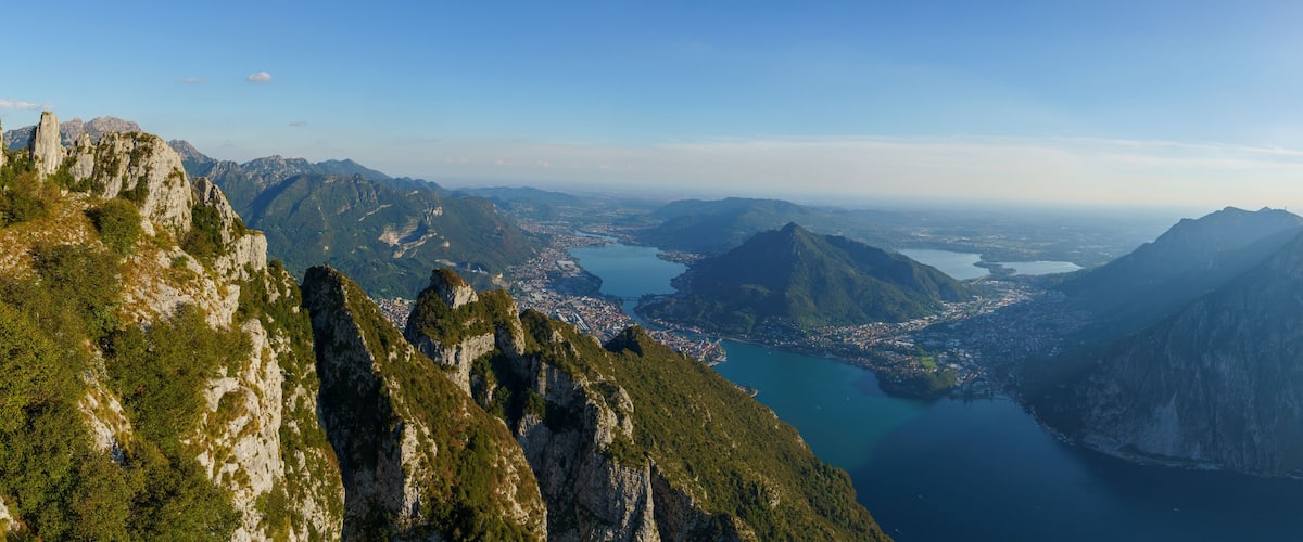 A mountainous landscape with a valley and a lake.