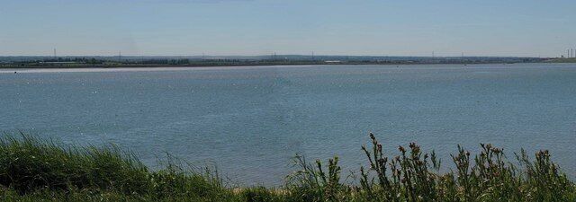 The Swale from Swale Hide. This is the view of The Swale from The Swale hide on Elmley Nature Reserve on the Isle of Sheppey. The RSPB request walkers keep below the sea wall to avoid disturbance to the birds, so the only views of the creek you can get are from the hides.