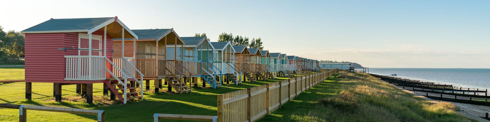 Beach huts with sea view in Leysdown-on-Sea, Isle of Sheppey, Kent, England, UK