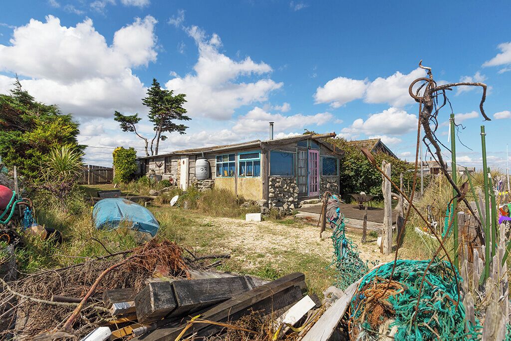 Cycling along the se front from Leysdown on Sea I came across a row of beach cottages, some in a better state of repair than others. This took my eye, full of driftwood, fishing nets and anything the sea had washed up, the place looks a great retreat.