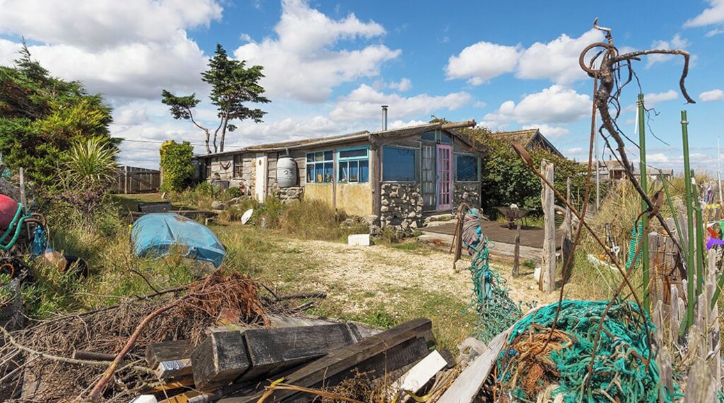 Cycling along the se front from Leysdown on Sea I came across a row of beach cottages, some in a better state of repair than others. This took my eye, full of driftwood, fishing nets and anything the sea had washed up, the place looks a great retreat.