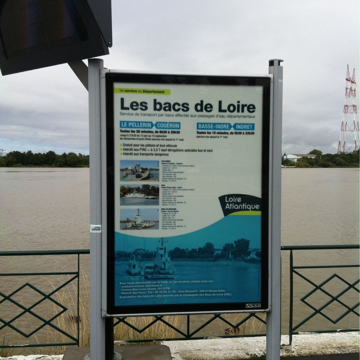 A signboard with information about boat services in Loire, including schedules and contact details.