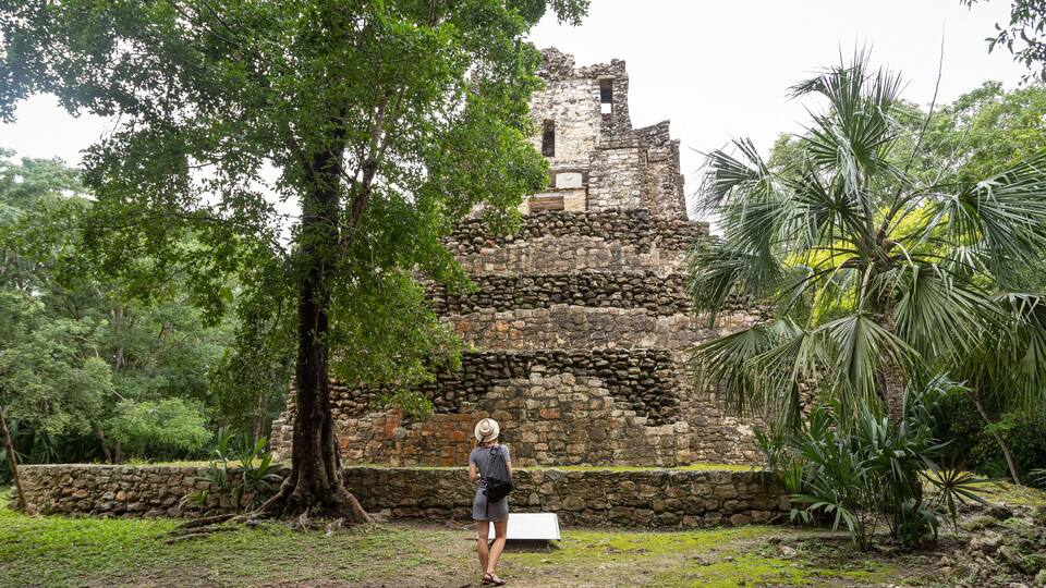 Lost city in the jungle. Mayan Muyil Ruins in Mexico. Ancient Mayan Pyramid at the Muyil site in Quintana Roo