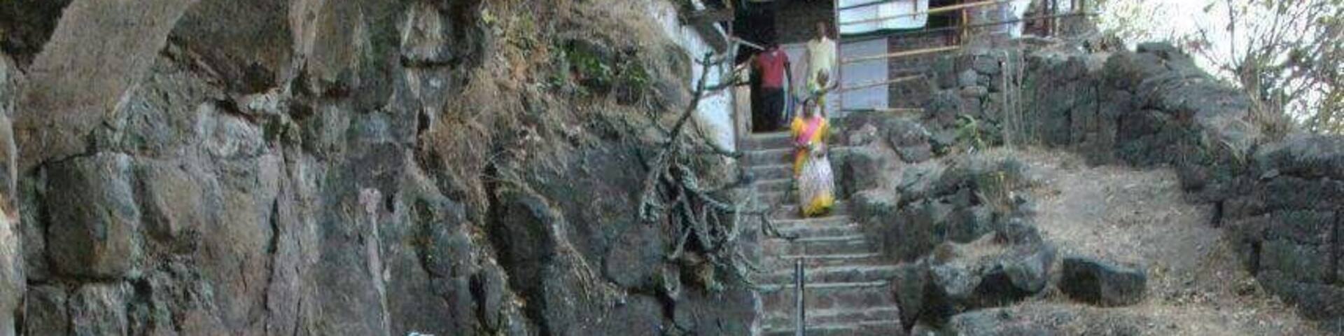 Steps going towards cave. To reach here one has to travel on rough road by vehicle for 3kms & one km walk up on hills.