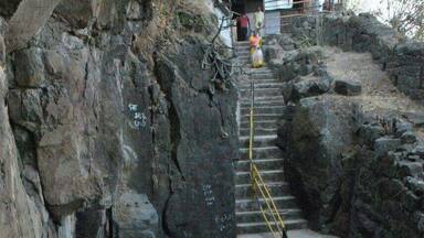 Steps going towards cave. To reach here one has to travel on rough road by vehicle for 3kms & one km walk up on hills.