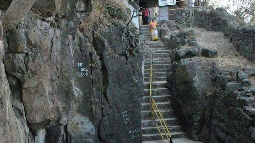 Steps going towards cave. To reach here one has to travel on rough road by vehicle for 3kms & one km walk up on hills.