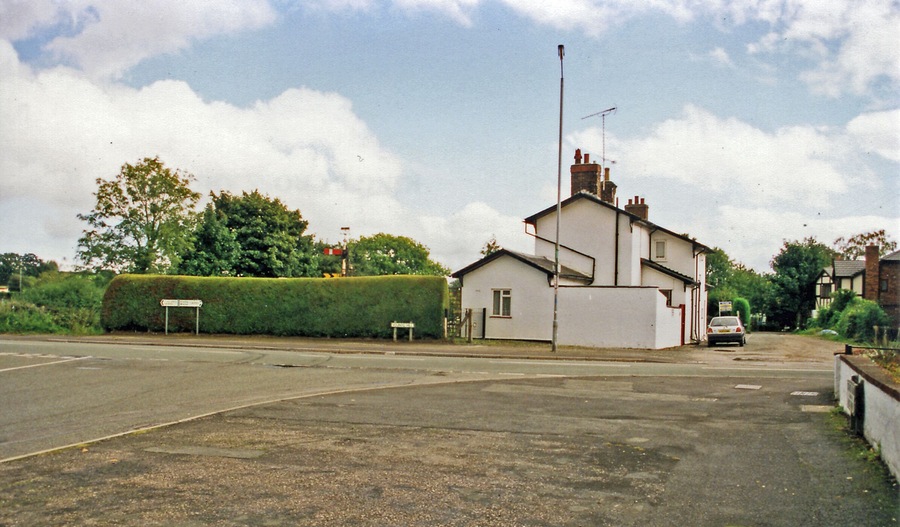 Former Hope & Pen-y-Fford station, 1999. View eastward on Vounog Hill, Pen-y-Fford, towards Saltney Junction and Chester: ex-LNW Chester - Mold - Denbigh line, closed 30/4/62. Note the signals in the garden.