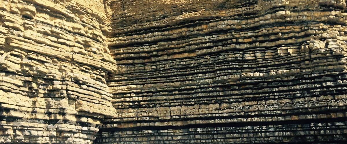 A rock formation with layered sedimentary rock.