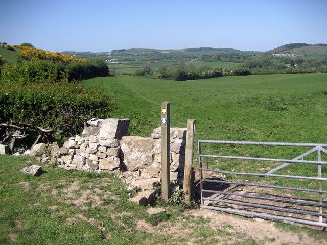 Offa's Dyke Path near Tyddyn-y-cyll For northbound walkers, the trail heading for Bryn Cnewyllyn after just passing through the farm at Tyddyn-y-cyll.