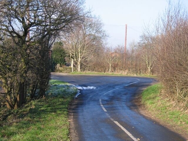 Hairpin Bend at Lowerhall Farm This really is an extremely tight hairpin bend in front of Lowerhall Farm, but the road has been widened to allow long vehicles some room to manoeuvre. Interestingly the 1881 O.S. map indicates a well on the inside the bend, presumably it has now been filled in.