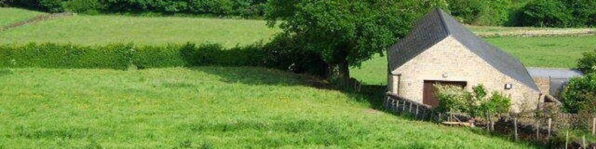 Field and barn Looking across the fields to Holloway.The building is a new pump house for the waterboard.