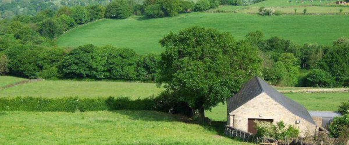 Field and barn Looking across the fields to Holloway.The building is a new pump house for the waterboard.
