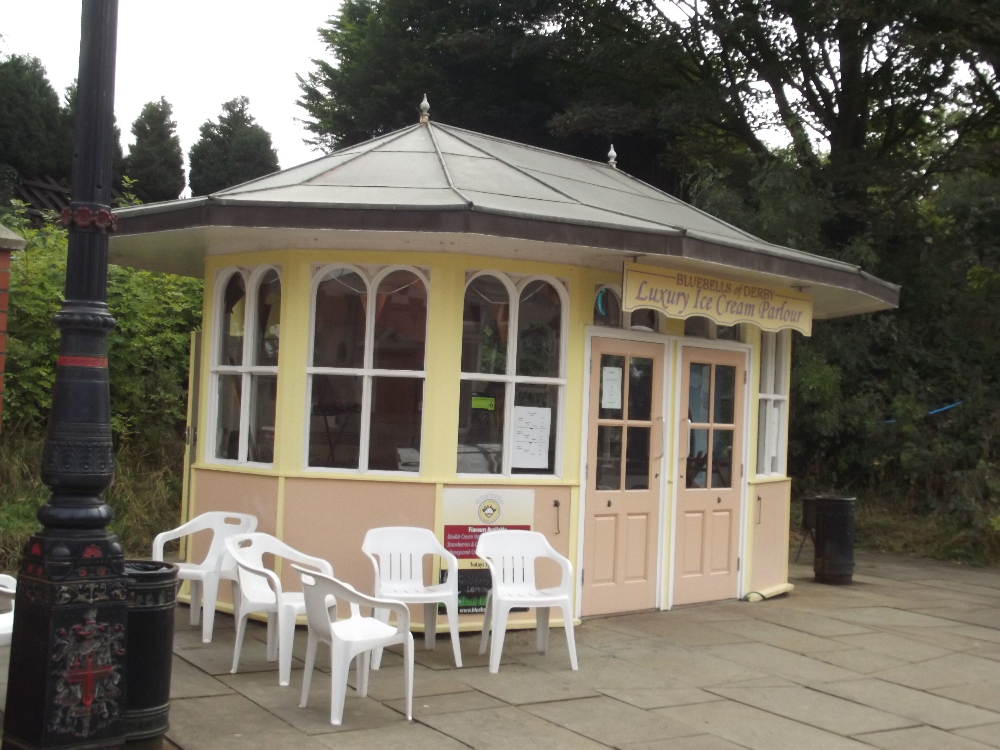 At the National Tramway Museum in Crich. The Museum started in the 1950s / 60s when most of the old tram networks in the cities of the UK were being closed down. The Tramway Museum Society was formed in the late 1940s when the decline began and they started to purchase the trams, track etc. The Crich site came to the attention of the society in the late 1950s. They later purchased the site. At the Crich Tramway Village. On Tramway Street. Bluebells of Derby Luxury Ice Cream Parlour
