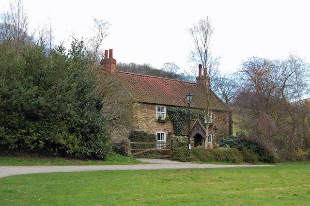 Church Cottage, Brantingham, East Riding of Yorkshire, England. This isolated cottage is situated just South of All Saints Church. It has the characteristic rustic log porch of many Brantingham homes - see the Post Office 759223 for another example.