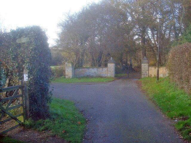 Entrance to St James Looking north-west to the churchyard gateway and small parking/turning space. The footpath off to the left leads to Linby.