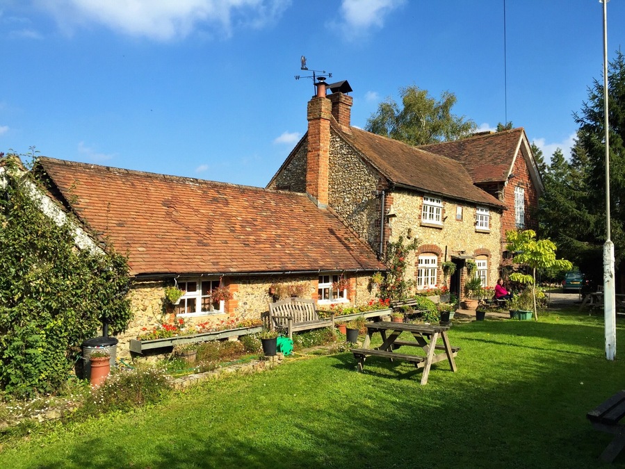 One of the oddest pubs I've ever been to. Live animals inside and a bar cluttered with household items and belongings. Independently owned so no on tap beer and you may worry about the cleanliness! At the mid-point of several local footpaths it's a welcome stop and I definitely recommend a visit.