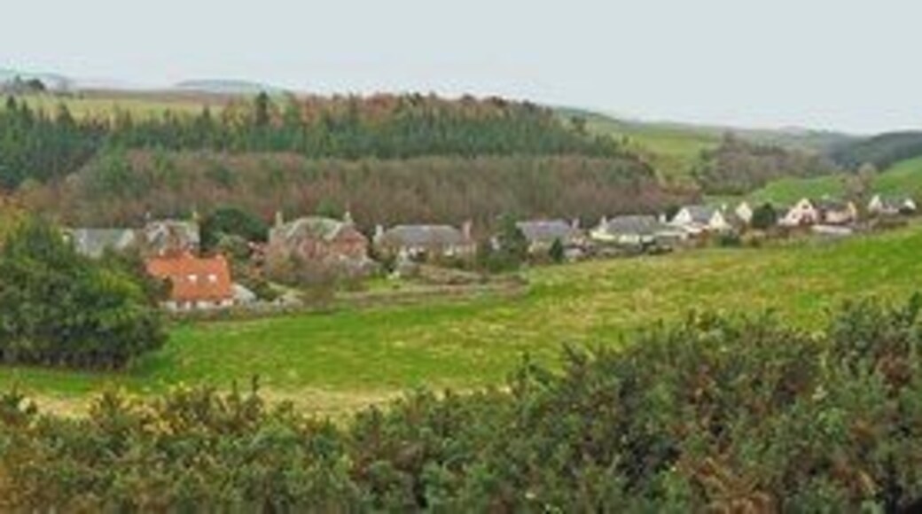 Garvald panorama from Law Knowes This is a linear village in a hidden valley below the Lammermuirs. Several of the buildings are listed and the village and its environs have been designated as a conservation area.